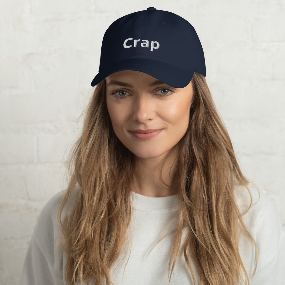 Woman wearing a navy Crap dad hat