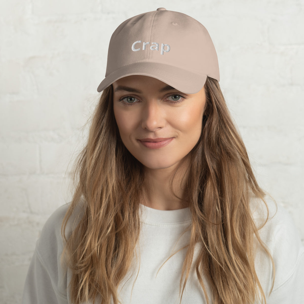 Woman wearing a stone Crap dad hat